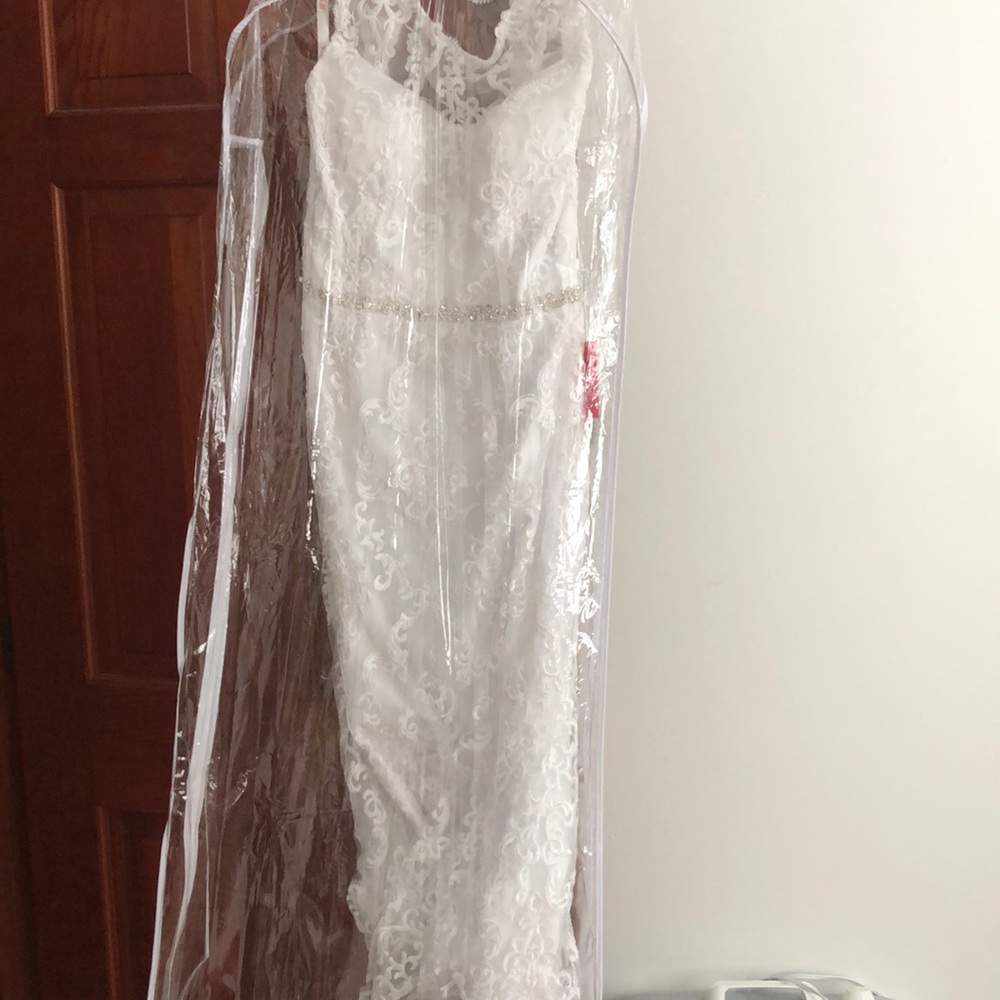 Unworn floor length wedding dress